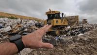 Inside a South Carolina landfill, a towering compactor shows how fast waste adds up