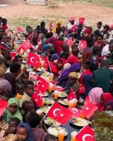 Merhem Hands Somali Children a Turkish Flag With Every Plate