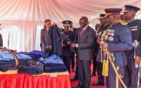 This man, Alusala, the richest teacher in the country and supply police uniform