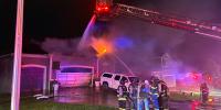 Crews battle heavy flames at Kansas City house fire