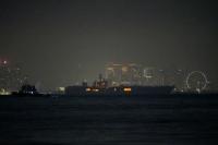 USS Abraham Lincoln sails past Singapore on its way home from Middle East