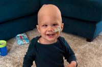 A Wigan firm has stepped in to help a toddler with brain cancer go on his dream holiday to Walt Disney World