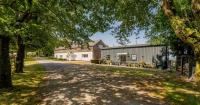 Cheshire farm with four-bed home, barn conversion and equestrian facilities for sale