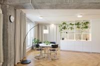 In Prague, a wall-less apartment showcases exposed concrete
