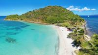 A remote island in the Caribbean with few locals is a gem with luxury resorts and world-class diving