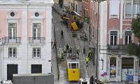 €2.3million is paid out to four of the 16 families of people who were killed in the Lisbon funicular crash - as final report into tragedy is delayed