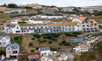 Don't turn our village into another Chelsea-on-Sea! Devon neighbours declare war on Dubai-linked outsiders over plan to turn historic family-run hotel into luxury waterfront venue