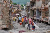 Flood survivors reach safe areas as families await news of nearly 3,000 missing