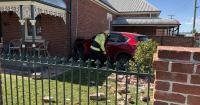 Car ploughs through fence, hits brick house at CBD intersection