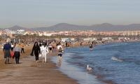 Woman, 22, is 'raped by illegal migrant on Spanish beach' after she went for an early morning swim