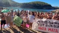 Hundreds flood popular Ibiza beach in protest against tourists