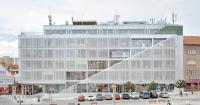 steel layered facade revives 1969 modernist city hall in czech republic