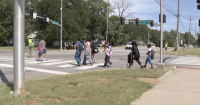 Hickman Mills, crossing guard company, working to keep student walkers safeb
