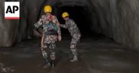 Rescuers search for workers trapped in flooded tunnels at power plants in Nepal