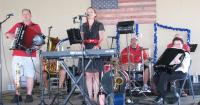Local musician played accordion with the Mollie Busta Band at the fair