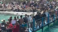 Brits rock up to beautiful beach only to find 'hellish' nightmare crammed with thousands