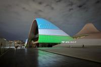 Heydar Aliyev Center building is illuminated in colors of Uzbek flag