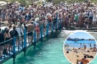 Greek officials seek tighter restrictions on tourists amid outrageous crowds at famed beach: ‘This is hell’