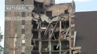Construction crews prepare to demolish collapsed building