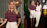Beaming Holly Willoughby and Davina McCall wrap their arms around each other in friendly snap as they catch up at a hair care event