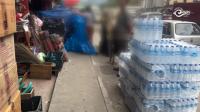 Pedestrians and businesses compete for space on Thimphu footpaths