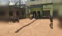 Farmers place chappal in queue for their turn to collect urea in Papannapet