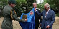 King Charles left in stitches as plaque falls to the ground during unveiling