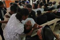 World Associated Press Mourners file into a church in Haiti where gangs killed dozens of people in latest rampage