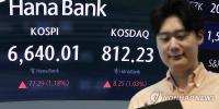 Seoul shares extend gains late Thu. morning as oil prices ease