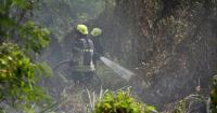 Firefighters work to extinguish Faleata Golf Course fire