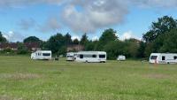 Tip trucks visit cancelled after travellers set up camp in park