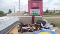 Neighbors concerned after clothing donation box in Cypress attracts illegal dumping