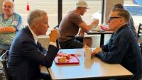 Prime Minister, Bryan Adams dishing over doughnuts in Thunder Bay