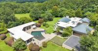 Orchard House has 4 bedrooms, mountain views and 1 million pounds of concrete. It listed for $1.8M.