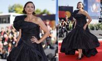 Maggie Gyllenhaal makes a statement in a black taffeta gown as she attends the A Place To Heal screening at the Venice International Film Festival