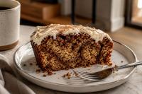 Cinnamon roll banana bread recipe with a cinnamon swirl and cream cheese frosting