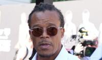 Fraudster who pawned Edgar Davids's art collection misses sentencing after 'being hit by luggage'