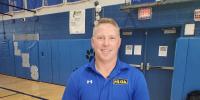 Lawrence High School physical education teacher Josh Blaisdell officiates lacrosse on national stage