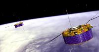 Scientists watch as two satellites burn