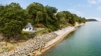 Quiet Guests Can Stay For Free In This Beachfront Swedish Cabin