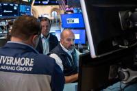 Stocks fall as strong jobs report hints at rate hike