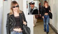 Suki Waterhouse embraces her inner rock chick in lace crop top and leopard print-collared leather jacket as she supports fiancé Robert Pattinson ahead of his premiere at Venice Film Festival