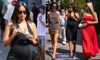 Charles Leclerc's wife Alexandra shows off her 'baby bump' in a black halterneck dress as she joins Formula One WAGs at Italian Grand Prix