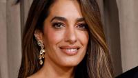 Amal Clooney, 48, flaunts her toned legs in snake-print skirt with jaw-dropping slit