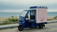 Blue three-wheeler makes waves for beach reading in Korea