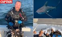 Horror as spear fisherman has BOTH of his arms savaged by angry 300lb bull shark off the coast of Florida