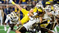 Michigan escapes on second-chance Hail Mary in Whittingham's debut