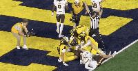 Michigan stuns Western Michigan on controversial Hail Mary