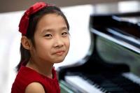Li is one of this music institute’s most promising new students, she’s 7 years old