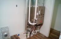 New Jersey condo owner comparing five HVAC quotes questions oversized AC recommendation